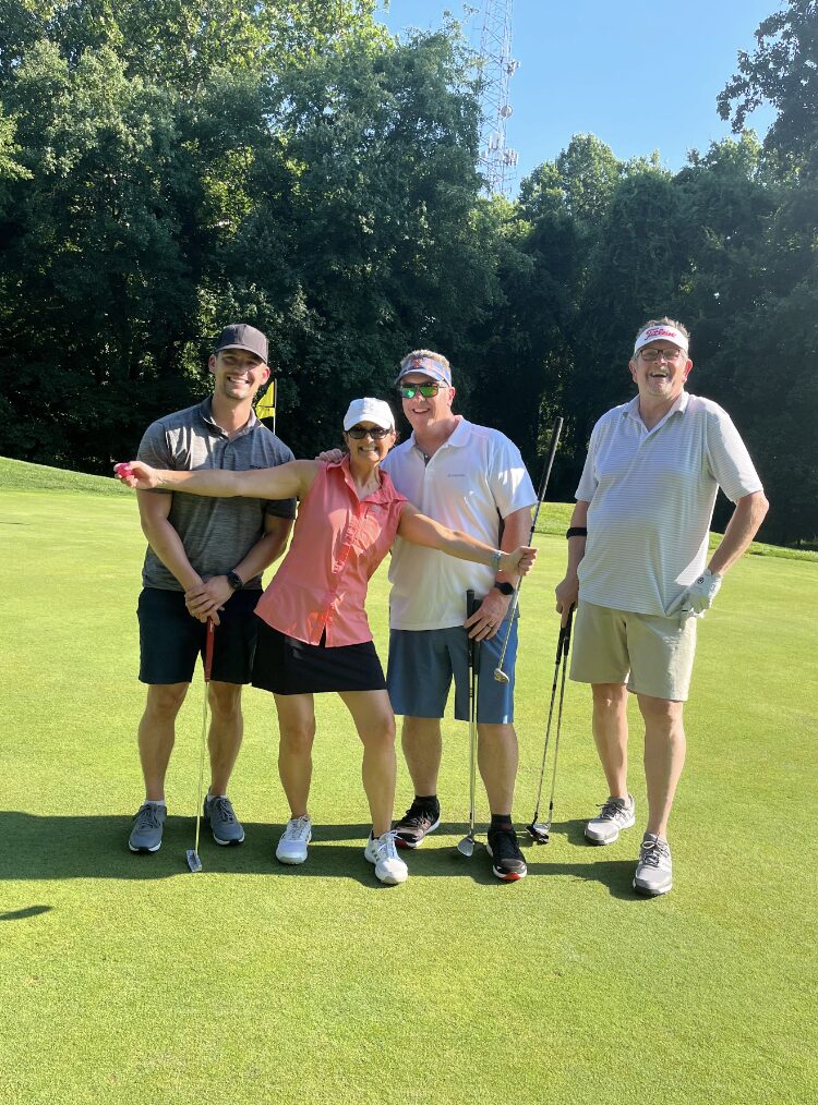 A group on the putting green